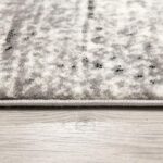 Close-up of textured gray and white carpet pattern.