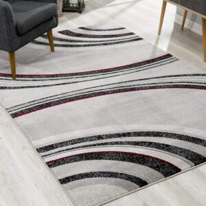 Modern area rug with gray and red geometric design.