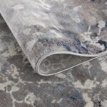 Close-up of a rolled-up patterned rug.