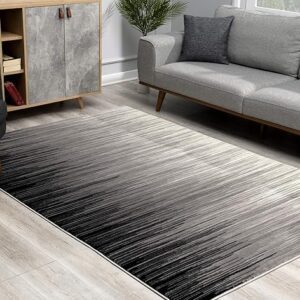 Modern living room with gray gradient rug.