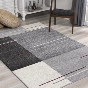 Gray geometric living room rug on wooden floor