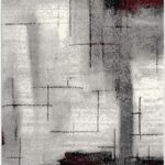 Abstract rug with geometric patterns in gray and red.
