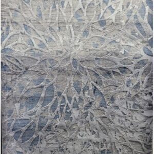 Abstract gray and blue textured area rug design.