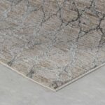 Gray patterned rug on wooden floor