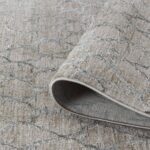 Close-up of rolled gray patterned carpet