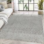 Modern living room with large patterned rug.