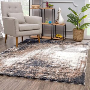 Modern living room with armchair and abstract rug.