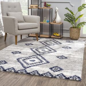 Living room with geometric patterned rug and armchair