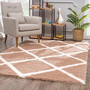 Modern room with geometric rug and armchair.