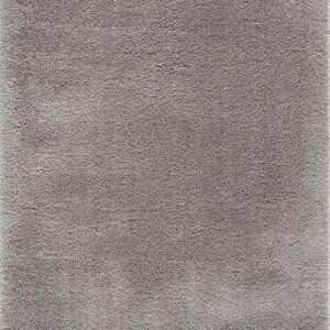 Close-up of a soft gray shaggy carpet.