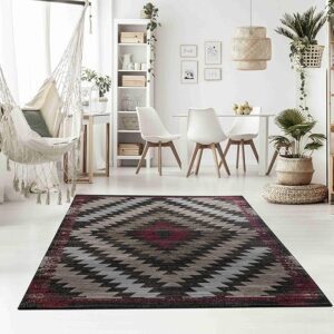 Stylish living room with geometric patterned rug.