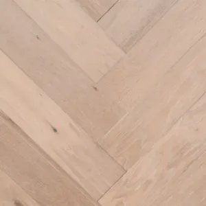 Light wood herringbone patterned flooring.