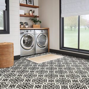 Laundry room with patterned tile flooring.
