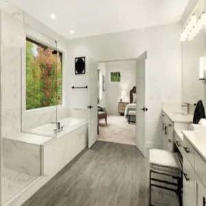 Modern bathroom with large tub and double vanity