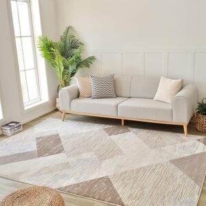 Modern living room with sofa and geometric rug.