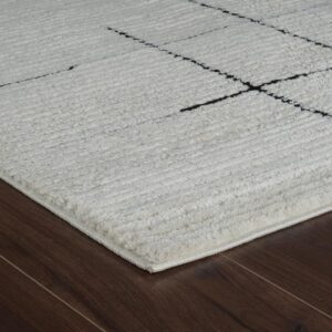White textured rug on wooden floor