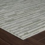 Striped area rug on hardwood floor