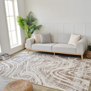 Modern living room with gray sofa, patterned rug.