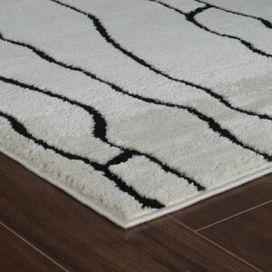 Black and white rug on wooden floor
