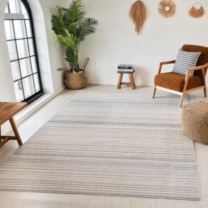 Modern living room with striped rug and decor.