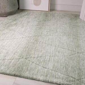 Soft gray rug on light wooden floor.