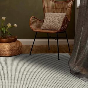 Cozy corner with chair, cushion, and vase