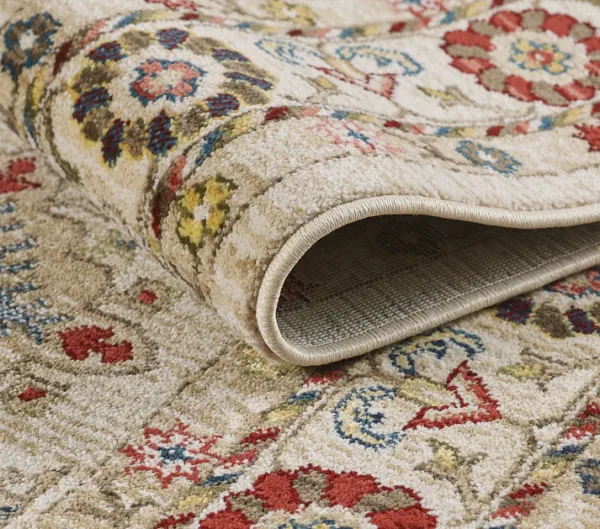 Close-up of rolled floral-patterned rug