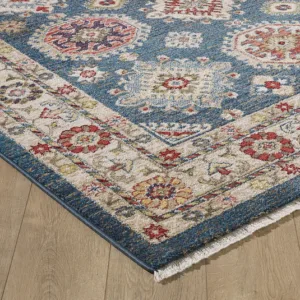 Colorful patterned rug on wooden floor