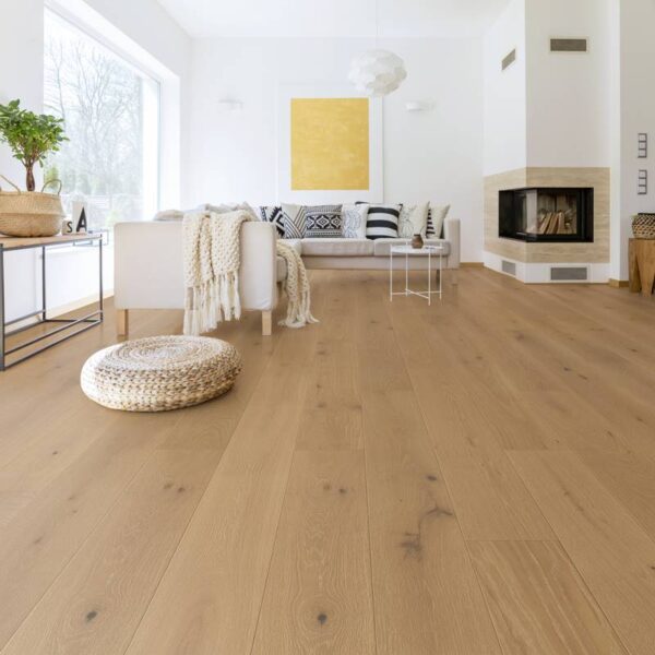 Modern living room with hardwood floors and fireplace.