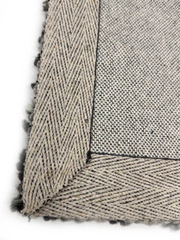 Close-up of woven fabric with herringbone pattern