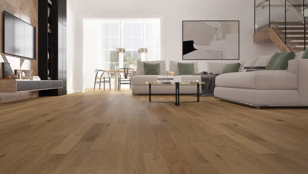 Modern living room with wood flooring and large couch.