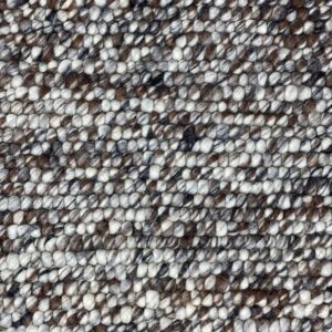 Close-up of textured, mottled brown and white fabric.