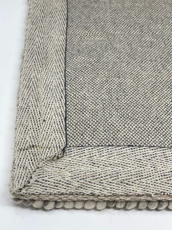 Gray woven textile with border design