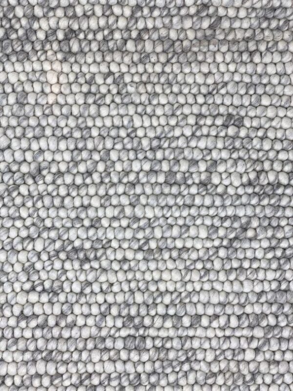 Close-up of textured gray wool carpet.