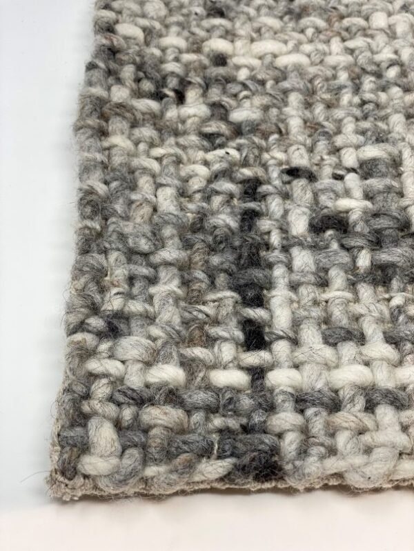 Close-up of gray woven textile texture.