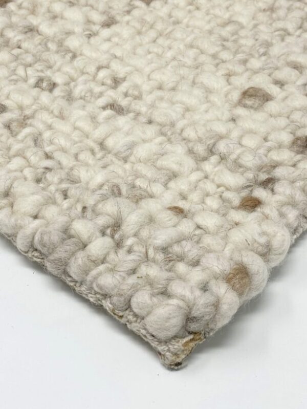 Close-up of a textured wool carpet.