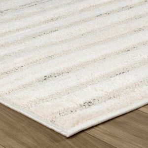 Beige striped carpet on wooden floor surface.