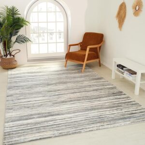 Modern living room with striped rug and chair.
