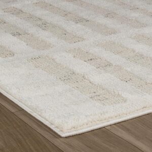 Beige textured rug on wooden floor