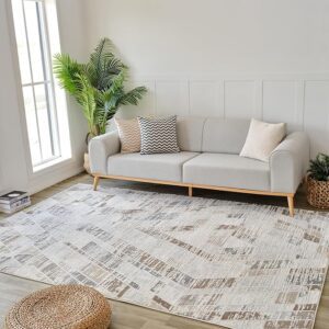 Modern living room with sofa and geometric rug.