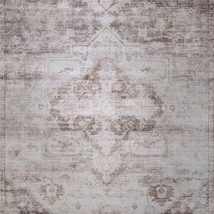 Vintage faded oriental carpet with intricate patterns.