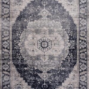Intricate black and gray patterned rug, vintage style.