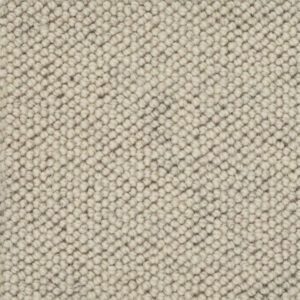 Beige textured wool carpet pattern close-up.