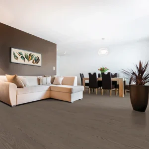 Modern living room with beige couch and dining area.