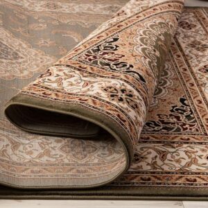 Rolled patterned Persian carpet on wooden floor.