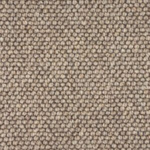Close-up of beige looped carpet texture