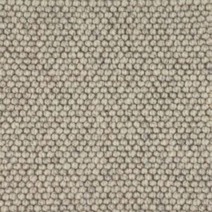 Close-up of beige wool carpet texture