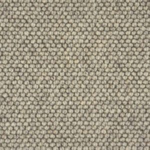 Close-up of beige loop carpet texture