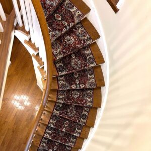 Decorative spiral staircase with patterned carpet