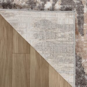 Corner of area rug on wooden floor